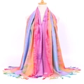 Close-up of vibrant peacock feather jacquard pattern and fringes on ethnic style scarf - Peacock Pink