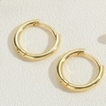 Close-up of 14K gold plated huggie earrings with polished mirror finish on textured background - 15MM Smooth Hoop Earrings (ES4044-1)