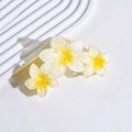 Close-up of matte white flower hair claw clip with yellow stamens and resin texture - 3# Yellow-White Gradient Triple Plumeria