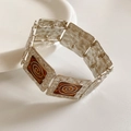 Dettaglio del bracciale vintage in argento con smalto marrone e motivi a spirale - Base Argento Spirale Marrone / Argento-Caffè