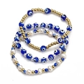 Detailed view of bohemian blue evil eye bead bracelet set with gold beads and pearls - Layered Dark Blue Gold Bead Pearl Style (BE843MI03)