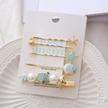 Set de horquillas doradas con estrella de mar, caracola, esmalte azul y perlas finas - Azul Set