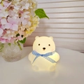 Cartoon bear night light in white with blue ribbon emitting a warm golden glow - Large Bear - Blue