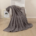 Solid color 3D jacquard flannel blanket in dark grey with cable knit texture on chair - Dark Gray