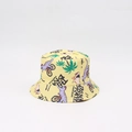 Close-up of yellow kids bucket hat with colorful dinosaur and palm tree print details - One Size (48-53cm Head Circumference) / Yellow