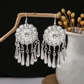 Silver bohemian flower earrings with long conical tassels hanging on a branch - Vintage Carved Disc Cone Tassel Style (E1086-7)