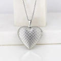 Silver heart locket necklace with wave texture on a minimalist white background - Fish Scale Heart/Steel