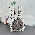 Knitted tote bag in cream white featuring brown polka dot pumpkin and black accents - Pumpkin Beige