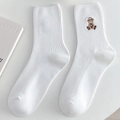 White cotton crew socks for women featuring a cute embroidered brown bear with number 84 - One Size / White