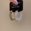 Detail of gold hoop earrings with sparkling rhinestones and silver pin luxury finish - Silver Pin Round Hoop / Gold