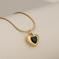 Elegant gold snake chain necklace featuring a black heart-shaped crystal pendant - Gold + Black Zirconia