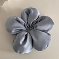 Detailed view of a blue-grey satin flower scrunchie with a glossy silk-like texture - 3D Flower Scrunchie - Light Grey (Original)