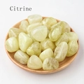 Natural polished citrine tumbled stones displayed in a minimalist round wooden dish - 100g/Pack / Citrine