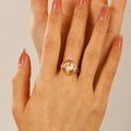 Minimalist golden ginkgo leaf ring on model hand with detailed hollow design finish - Gold Hollow Ginkgo Leaf Ring (10532)