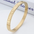 Bracciale rigido dorato in acciaio inossidabile con incisioni sole luna e stelle vintage - Oro