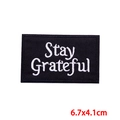 Black 'Stay Grateful' embroidered patch 6.7x4.1cm with white lettering for DIY clothing - Stay Grateful