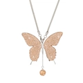 Macro detail of silver butterfly car pendant with sparkling champagne rhinestones - Peach