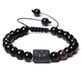 Fashionable black beaded zodiac bracelet featuring a gold Taurus symbol charm - Taurus