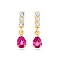 Macro shot of gold earrings with three white stones and a pear-cut pink zircon drop - Rose Red Gold