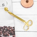 Elegant golden candle wick trimmer tool on a white wooden background with coffee beans - Gold Wick Trimmer