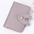 Detail of light purple PU leather card holder showing fine texture and white stitching - Purple