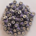 Macro shot of purple clay pave beads with crystals and metal eyelets for DIY jewelry - Lotus Purple