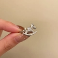 Detailed macro view of silver zircon rocking horse ring held to show scale and design - Rocking Horse Style / Silver