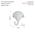 Ocean-themed white shell wall hook made of cast iron, 10.8x9cm decorative hanger - Cast Iron / Shell