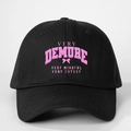 Close-up of black cotton baseball cap with pink Very Demure print and curved brim - Adjustable / Black