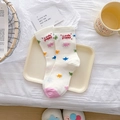 White crew socks with colorful stars, pink toe, and Little Puppy text detail - Exploding Stars