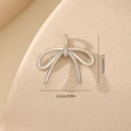 Detailed view of a silver bow pendant with zircon inlays and precise size dimensions - 3D Bowknot Style MYYX00635 / Silver