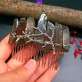 Close-up of handmade smoky crystal hair comb with silver branch and gothic aesthetic - Smoky Quartz + Branch