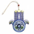 Detail of wooden Hamsa Hand with blue Evil Eye and fish pattern wall hanging - Blue and Yellow Fish