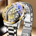 Close-up of automatic skeleton watch featuring gold gears and blue tinted glass - Two-tone Gold Dial