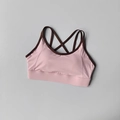 Pink sports bra with brown trim and cross-back straps on light grey background - S / Tops / Pink Coffee