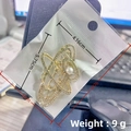Gold starburst brooch with sparkling rhinestones and pearl detail shown in 5.75cm size - KC Gold Planet
