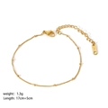 Macrodetail van goudkleurige roestvrijstalen kralenketting met karabijnsluiting en verlengstuk - Bolletjesketting Stijl (YYB023030)