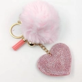 Detail of pink plush pompom and rhinestone heart pendant with golden keychain - Pink