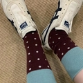 Polka dot crew socks in red and white paired with classic white canvas sneakers - Brown