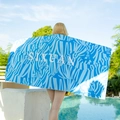 Blue and light blue zebra print quick-dry beach towel with white central lettering - Zebra