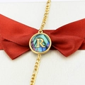 18k gold plated bracelet featuring a round shell pendant with letter R and red ribbon - Letter R