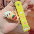 Strawberry milk tea keychain with yellow strap featuring rainbow and flower charms - Strawberry Ice Cream / Yellow