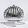 Sleek silver shell-shaped acrylic evening clutch with a polished metallic mirror finish - Silver