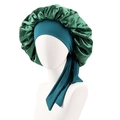 Close-up of dual-color satin sleep cap showing dark green and peacock blue silk texture - Green