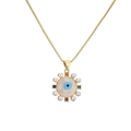 Gold plated evil eye necklace with pearls and colorful zircon accents on white background - Round Pearl Colorful Zircon Evil Eye
