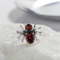 Detailed macro view of silver spider ring featuring two red oval garnet gemstones - Natural Garnet Spider Ring LR270