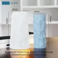 Column silicone mold and light blue wavy candle on wooden surface with flame - Pillar D ZL-870