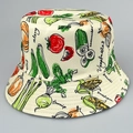 Reversible bucket hat in off-white canvas with colorful vegetable illustration prints - M / Cucumber Green