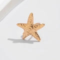 Elegant gold metallic starfish ear clip featuring a textured hammered finish for women - Gold Hammered Sea Star Style (03553)