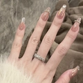Close-up of S925 silver ring with textured design and pink zirconia on female hand - J5310 Silver Textured Ring Set